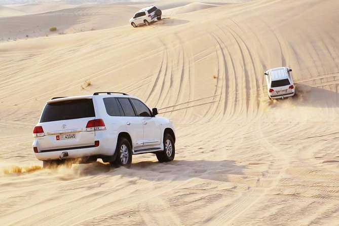 Morning Desert Safari with Camel Ride & Sand Skiing Private Tours - First Stop: Pickup From Abu Dhabi and the Trip Into Al Khatim
